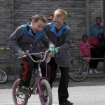 Young participants perform the 'Learning to Ride' section